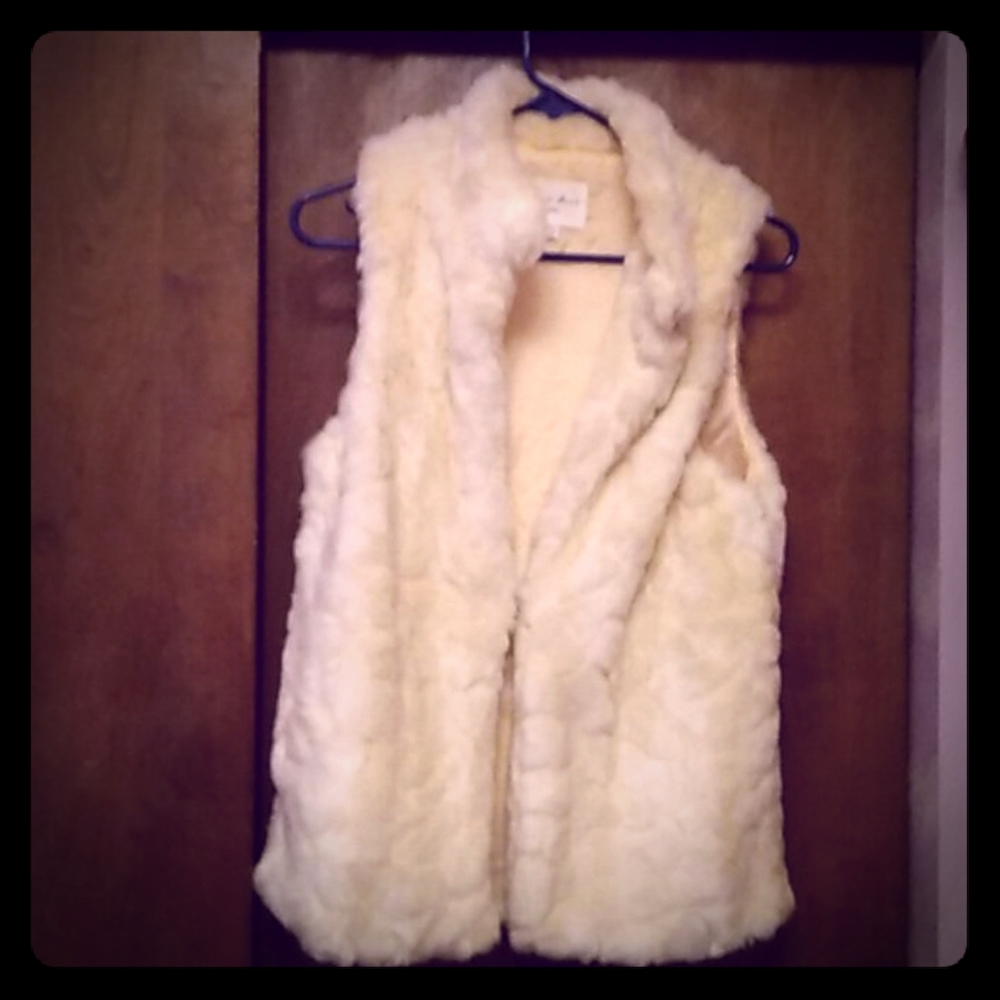 Cream colored faux fur vest